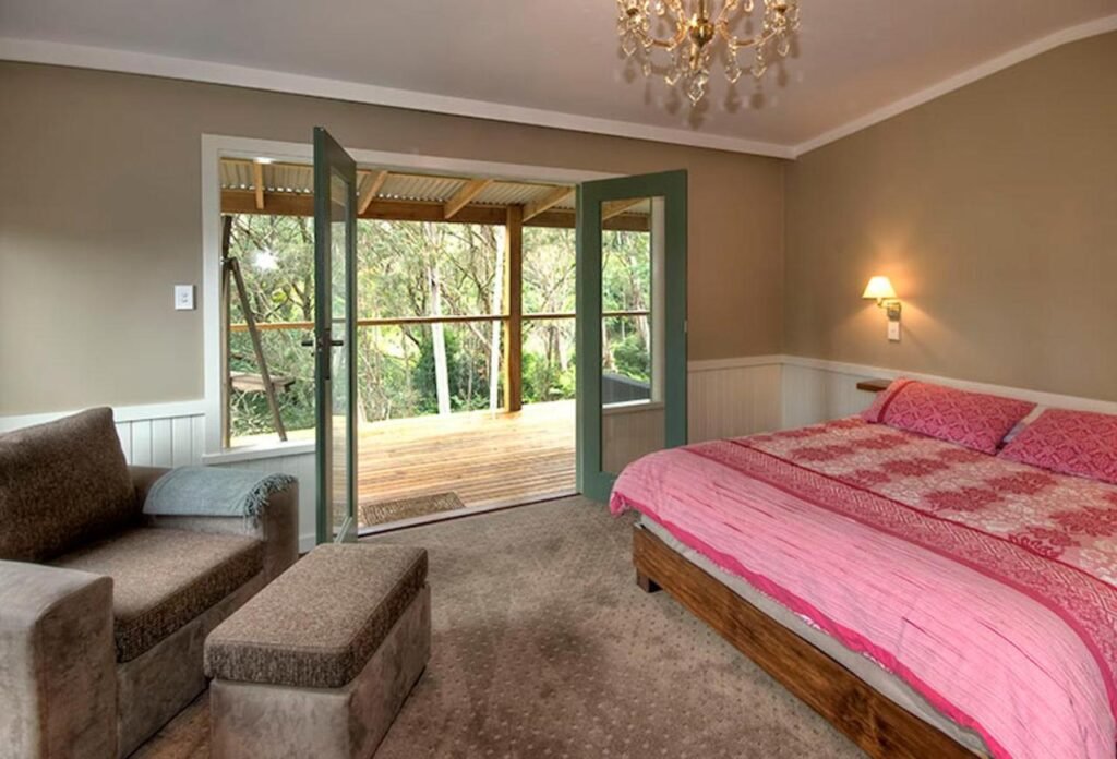 Bedroom overlooking trees in Katoomba